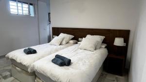 A bed or beds in a room at El nido del amá