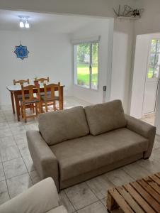 a living room with a couch and a table at La Serena in Azul