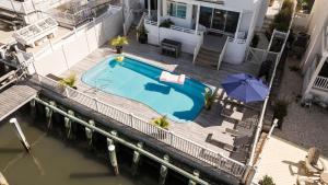 an overhead view of a swimming pool on a house at Miami Vice Ocean City- 5BR | Private Pool | Views in Ocean City