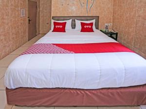 Postel nebo postele na pokoji v ubytování SUPER OYO 92672 Hotel Bsd + 22 fotografií