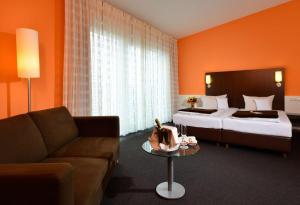 Postel nebo postele na pokoji v ubytování Best Western Plus Konrad Zuse Hotel