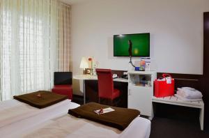 Postel nebo postele na pokoji v ubytování Best Western Plus Konrad Zuse Hotel