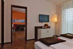 Postel nebo postele na pokoji v ubytování Best Western Plus Konrad Zuse Hotel