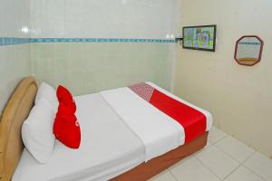 En eller flere senge i et værelse på Hotel O Melati