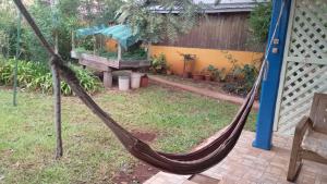a hammock in a yard in a garden at Rincón verde in Eldorado
