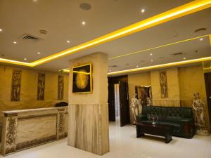 a lobby with a couch and a table in a building at Al Manara Premium Deluxe Sheikh Zayed View Studio in Dubai