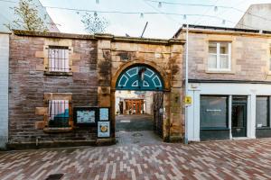 an entrance to a brick building with an archway at Brothers Perth City Centre in Perth