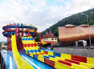 a water park with a colorful roller coaster at Studio Ștefan in Călimăneşti