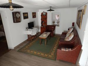 a living room with a couch and a table at Casa Nodar in Chantada