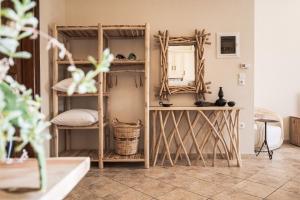 a room with bunk beds and a mirror at Fasolaki Skopelos - Eco Residences in Skopelos Town +105 photos