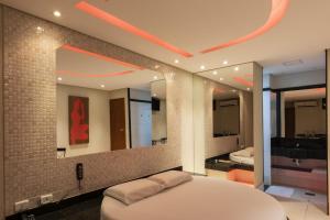 En eller flere senge i et værelse på Drops Motel Goiânia