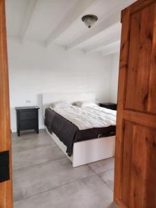 Una cama o camas en una habitación de Viña Le Vigneron
