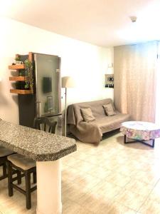 a living room with a bed and a table at Comfort in Playa las Americas in Playa de las Americas
