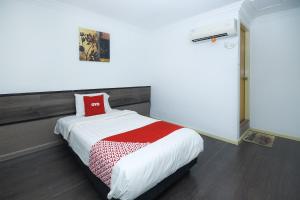 Postel nebo postele na pokoji v ubytování OYO 90820 River Inn