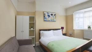 a bedroom with a large bed and a window at Havana Lodge in Elswick