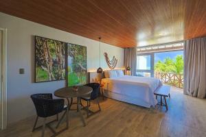 Cama ou camas em um quarto em Pousada Marceneiro