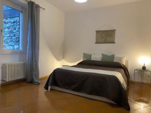 Postel nebo postele na pokoji v ubytování A D Rooms - Il Campanile