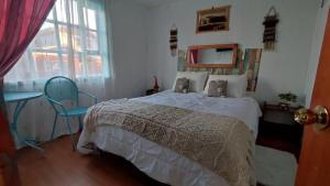 Postel nebo postele na pokoji v ubytování Hostal Castro Chiloé - Chacabuco #279