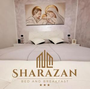 a bed with a sign that reads bed and breakfast at Sharazan in Canicattì