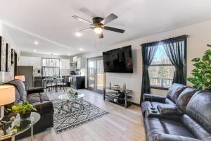 a living room with a couch and a ceiling fan at Kentucky Lake Retreat 4 Mi to Shore Boat and Fish! in New Johnsonville