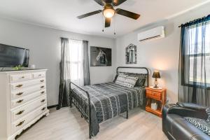 a bedroom with a bed and a ceiling fan at Kentucky Lake Retreat 4 Mi to Shore Boat and Fish! in New Johnsonville