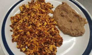 a plate of food with a piece of food and a cookie at Hotel Posada del Yaqui in Ciudad Obregón