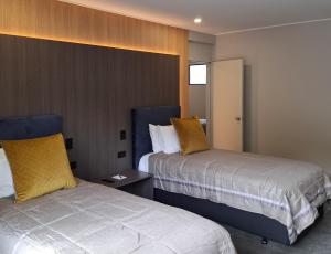 Letto o letti in una camera di Distinction Coachman Hotel, Palmerston North