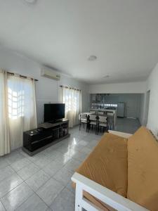 a living room with a couch and a dining room at Casa ciudad de San Luis in San Luis +29 photos
