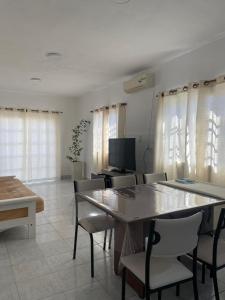 a dining room with a table and chairs at Casa ciudad de San Luis in San Luis