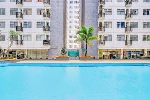 Bazén v ubytování Collection O 92981 Apartemen The Jarrdin By Gold Suites Property nebo v jeho okolí + 23 fotografií