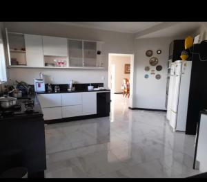 Kuchyň nebo kuchyňský kout v ubytování Casapiscina