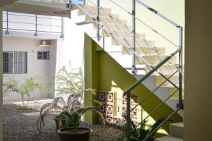 a staircase in a building with potted plants at LiV109 Norte Depa 3 in Cd Obregon in Ciudad Obregón
