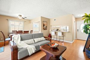 a living room with a couch and a table at Modern 4B Retreat with Cozy Decor in Upland