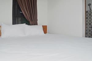 Photo de la galerie de l'établissement Super OYO 93085 Homy Stay Syariah, à Balikpapan 19 autres photos