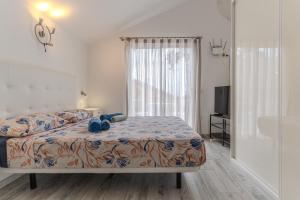 a bedroom with a bed and a window at Renovated Villa in Las Americas Sea Coast in Playa de las Americas