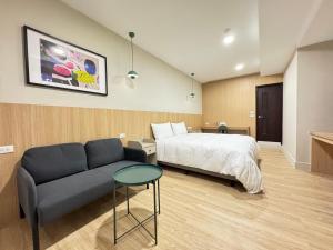 Postel nebo postele na pokoji v ubytování Yoshi Hotel - Tainan Sinmei Branch