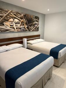 Postel nebo postele na pokoji v ubytování Isla Verde Hotel