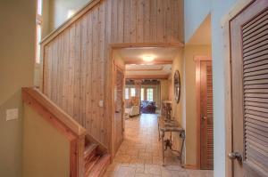 a hallway with a wooden wall and a stairway at THC0649 - Third Creek Comfort in Incline Village