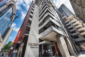 a building in the middle of a city at Cozy Spacious Holiday 2B2B Melbourne CBD Apartment in Melbourne