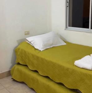 Ένα ή περισσότερα κρεβάτια σε δωμάτιο στο Termas Vida
