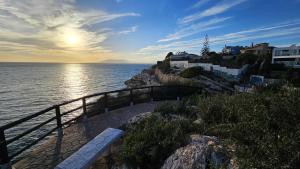 a view of the ocean with a bridge and buildings at Apartamento Marion in Cala del Moral