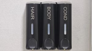 a group of black tooth brushes sitting on a wall at Apartamento Marion in Cala del Moral
