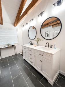 a bathroom with a sink and a mirror at Cabin Sweet Cabin in Burlington +39 photos