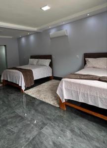 Cama o camas de una habitación en Pousada Cascata de Pedra