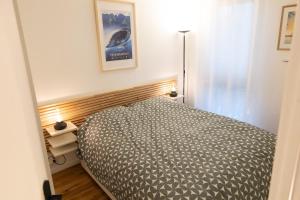 En eller flere senge i et værelse på Meublé de tourisme 3 étoiles Les Berges de Marne