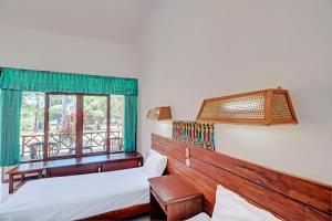 Postel nebo postele na pokoji v ubytování Capital O 93236 Hotel Hapel Negara
