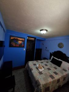 Postel nebo postele na pokoji v ubytování Hotel Luisito