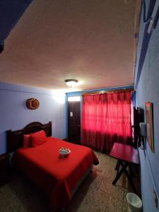 Postel nebo postele na pokoji v ubytování Hotel Luisito
