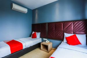 Postel nebo postele na pokoji v ubytování OYO 90894 Hotel Smc I-city