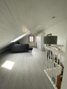 a large living room with a couch and a table at Luxury Rhine Retreat Garten&Sauna in Busingen am Hochrhein +14 photos